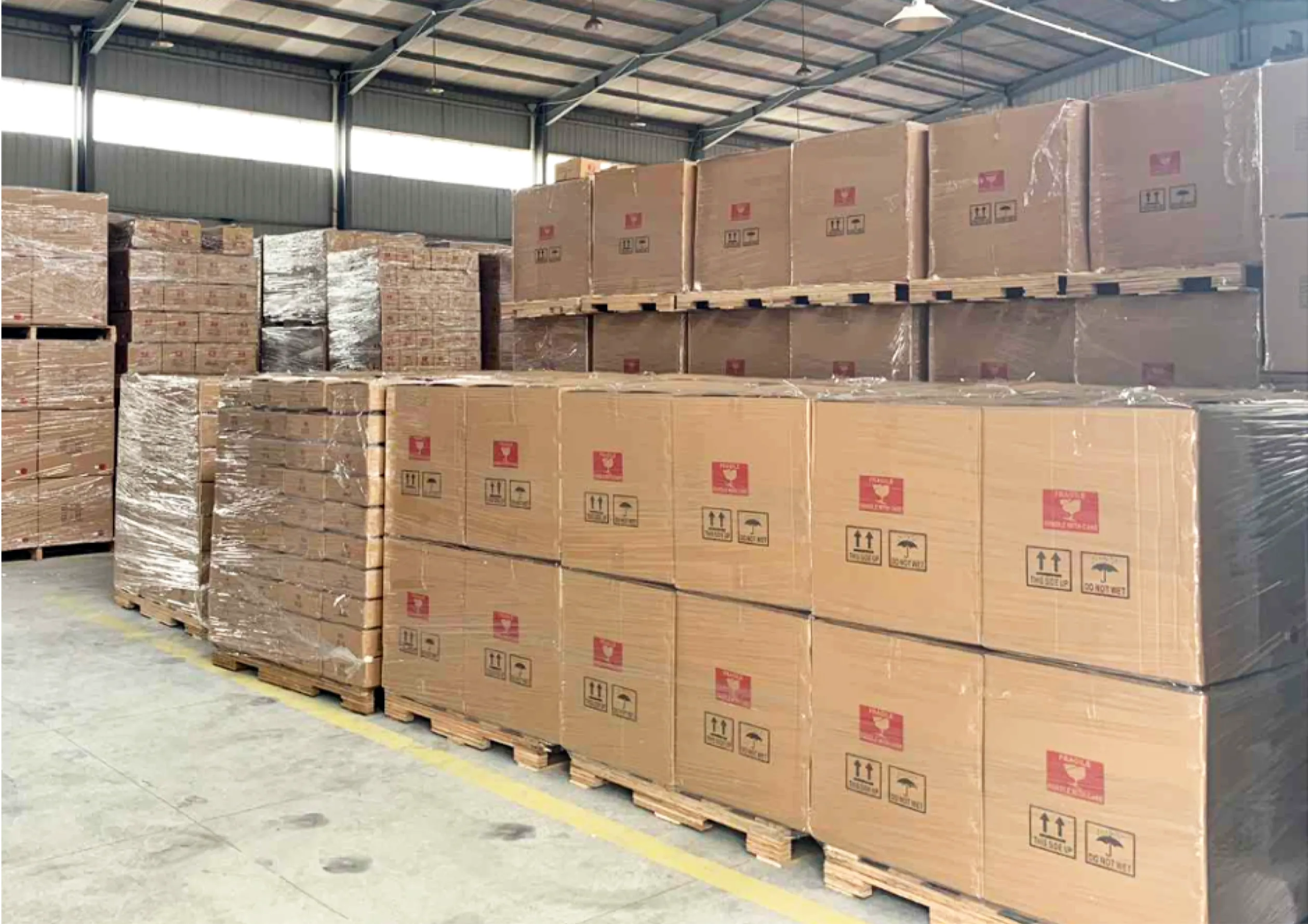 Boxes stacked tidily in a warehouse